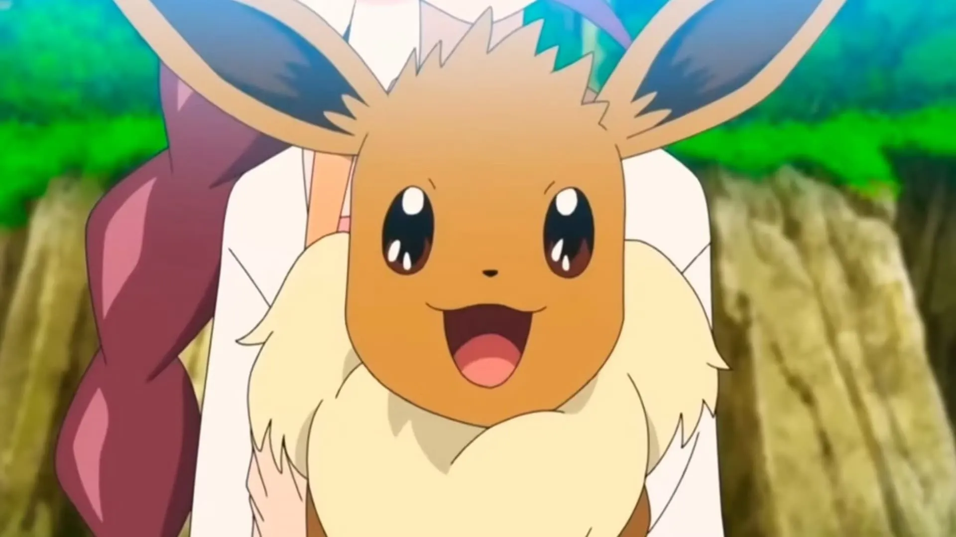 Eevee với bộ lông mềm mại màu nâu nhạt, đôi tai to và cái bờm lông xù dễ thương trong anime Pokémon.