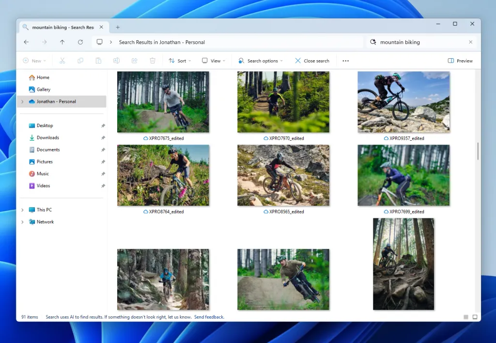 Giao diện tìm kiếm ảnh bằng ngôn ngữ tự nhiên trong File Explorer Windows 11, hiển thị kết quả "xe đạp địa hình" từ OneDrive