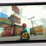 Màn hình Nintendo Switch 2 hiển thị game Mario Odyssey với Mario cưỡi scooter.