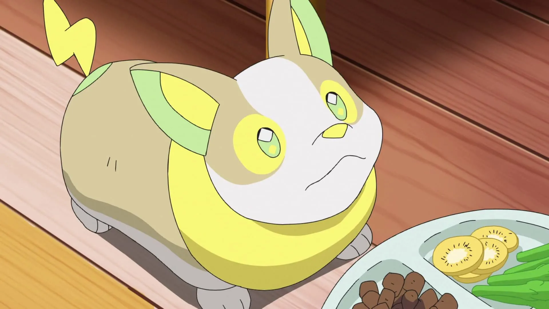Yamper, chú chó Pokémon nhỏ nhắn với bộ lông màu vàng cam và trái tim hình sét, đang chạy trong anime Pokémon.